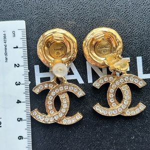 sold Authentic Chanel vintage rhinestone CC dangle clip on earrings